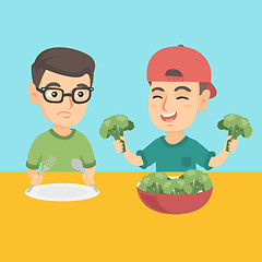 Image showing Two caucasian boys eating broccoli.