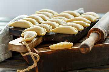 Image showing Fresh dumplings with cottage cheese on the kitchen table.