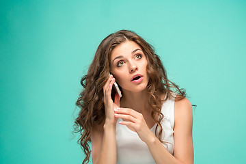 Image showing The portrait of disgusted woman with mobile phone