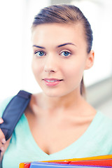 Image showing student girl with school bag and color folders