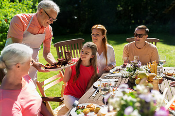 Image showing happy family having dinner or summer garden party