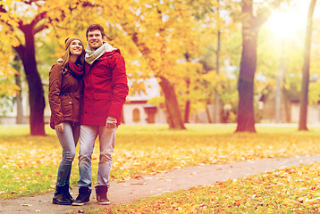 Image showing happy young couple walking in autumn park