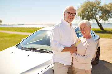 Image showing happy senior couple at car in summer