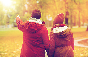 Image showing happy young couple walking in autumn park