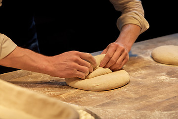 Image showing chef or baker cooking dough at bakery