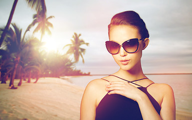 Image showing beautiful young woman in elegant black sunglasses