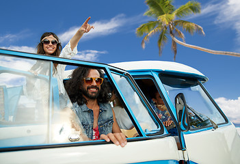 Image showing happy hippie friends in minivan car on beach