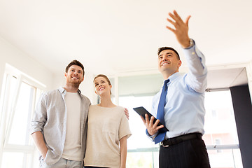 Image showing couple and realtor with tablet pc at new home