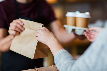 Image showing man or bartender serving customer at coffee shop