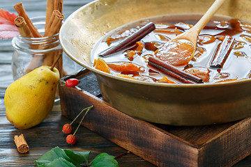 Image showing Copper basin with jam from pears.