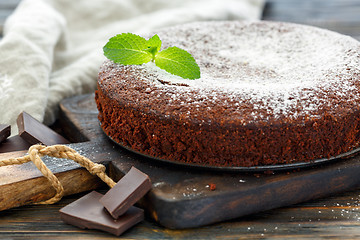 Image showing Chocolate cake dusted with powdered sugar.