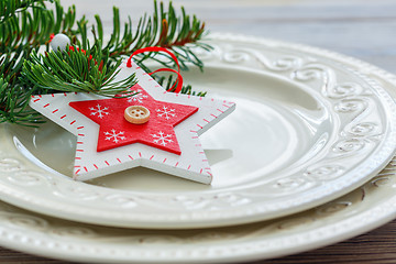 Image showing Christmas decor on a white porcelain plate.