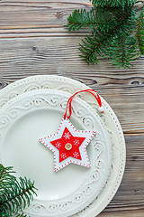 Image showing Porcelain plates with Christmas decor.