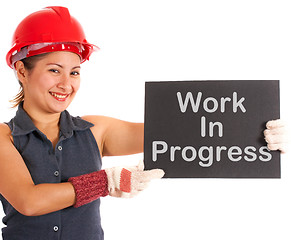 Image showing Work In Progress Sign Held By Construction Worker