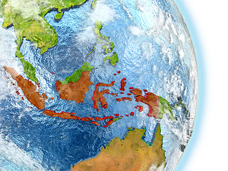 Image showing Indonesia in red on Earth