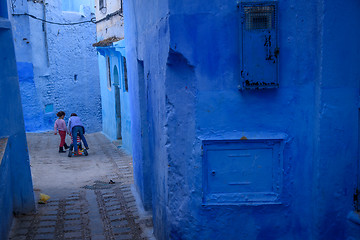 Image showing Kids in Chefchaouen, the blue city in the Morocco.