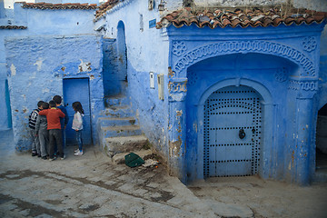 Image showing Kids in Chefchaouen, the blue city in the Morocco.