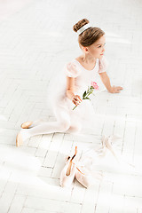 Image showing The little balerina in white tutu in class at the ballet school