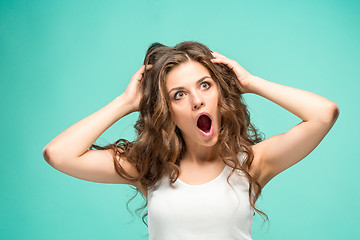 Image showing Portrait of young woman with shocked facial expression