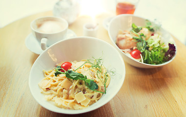 Image showing close up of pasta in bowl on table at restaurant