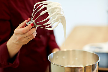 Image showing chef with whisk and whipped egg whites at kitchen