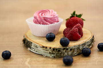 Image showing zephyr or marshmallow with berries on stand