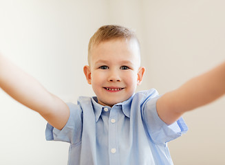 Image showing happy smiling little boy taking selfie