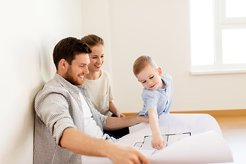 Image showing happy family with blueprint moving to new home