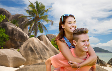 Image showing happy teenage couple having fun on summer beach