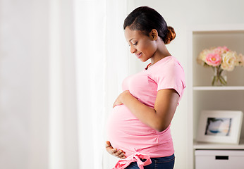 Image showing happy pregnant woman with big belly at home