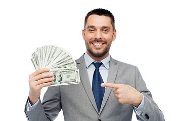 Image showing smiling businessman with american dollar money