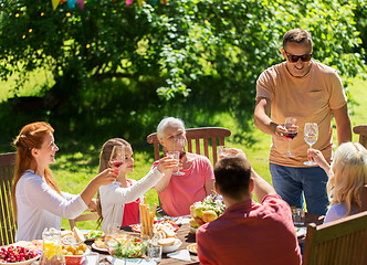 Image showing happy family having dinner or summer garden party