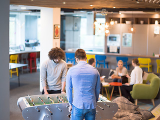 Image showing Office People Enjoying Table Soccer Game