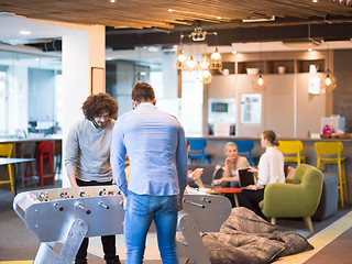 Image showing Office People Enjoying Table Soccer Game