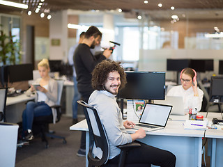 Image showing businessman working using a laptop in startup office