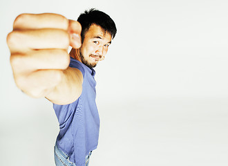 Image showing young cute asian man on white background gesturing emotional, po