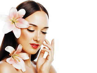 Image showing young attractive lady close up with hands on face isolated flowe