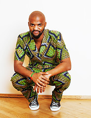 Image showing portrait of young handsome african man wearing bright green nati