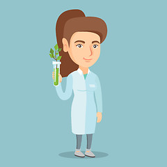 Image showing Scientist holding test tube with young sprout.