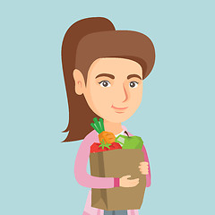 Image showing Woman holding shopping bag with healthy food.