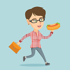 Image showing Caucasian business woman eating hot dog on the run