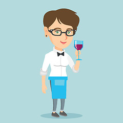 Image showing Caucasian waitress holding a glass of wine.