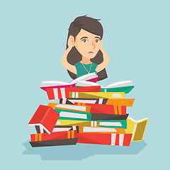 Image showing Caucasian student sitting in a huge pile of books.