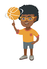 Image showing African boy spinning basketball ball on finger.