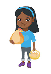 Image showing African girl holding a chicken and hen eggs.