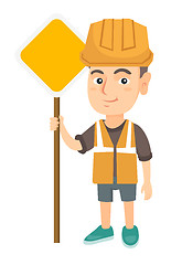 Image showing Little caucasian builder boy holding road sign.