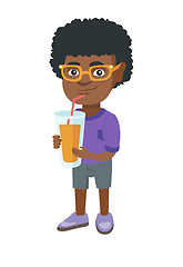 Image showing Boy drinking orange juice through a straw.