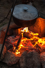 Image showing Preparing food on campfire