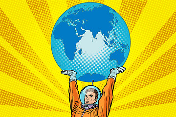 Image showing Retro astronaut is holding the planet Earth