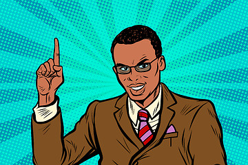 Image showing African businessman pointing finger up